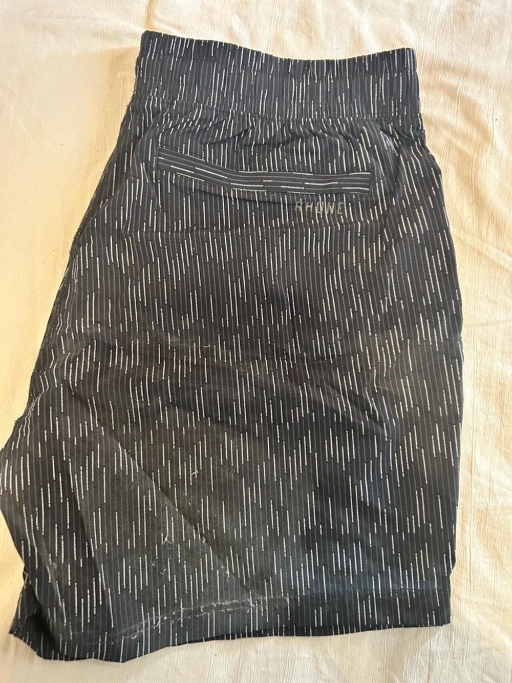 RHONE Black Shorts with White Pinstripe Detail